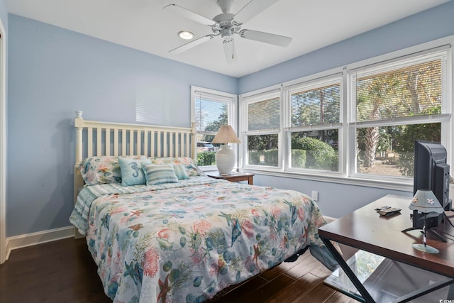 bedroom featuring ceiling fan and dark hardwood / wood-style flooring