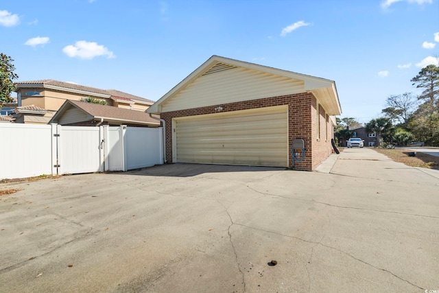 view of property exterior with a garage