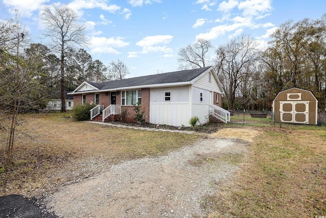 view of front of home with a storage unit