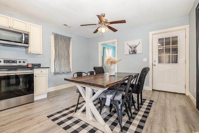 dining room featuring ceiling fan and light wood-type flooring