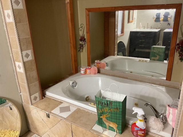 bathroom featuring a relaxing tiled tub and sink