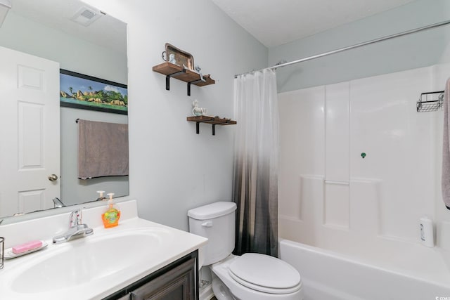 full bathroom with vanity, toilet, and shower / bath combo with shower curtain