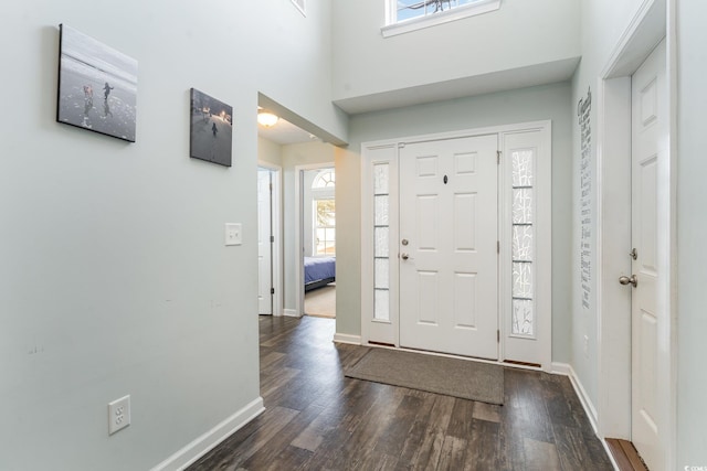 foyer with dark hardwood / wood-style floors