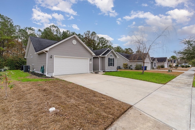 ranch-style home with central AC, a garage, and a front lawn