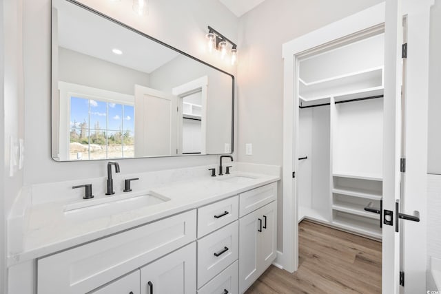 bathroom with vanity and hardwood / wood-style floors