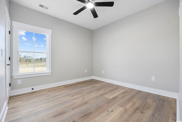 spare room featuring light wood-type flooring and ceiling fan