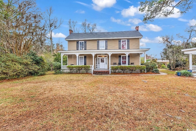 6011 Dick Pond Rd, Myrtle Beach, SC 29588 - view of front facade featuring covered porch and a front lawn
