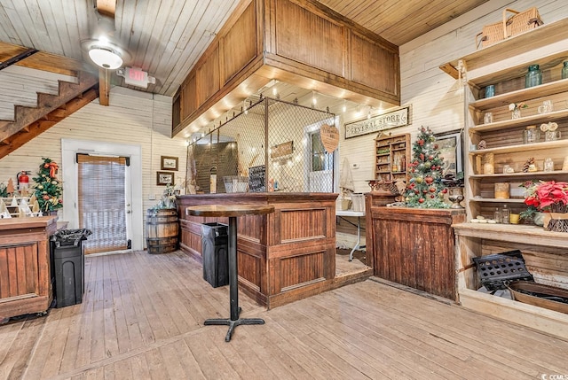 6011 Dick Pond Rd, Myrtle Beach, SC 29588 - interior space featuring pendant lighting, light wood-type flooring, and wood walls