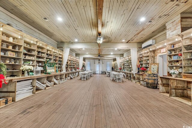 6011 Dick Pond Rd, Myrtle Beach, SC 29588 - interior space featuring ceiling fan, a wall mounted air conditioner, wooden ceiling, and hardwood / wood-style flooring