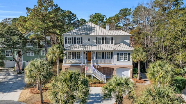 view of front of house with a garage and covered porch