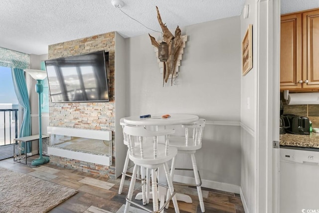 dining area featuring a textured ceiling