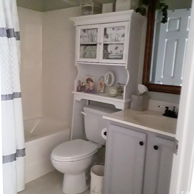 full bathroom featuring vanity, shower / bath combination with curtain, and toilet