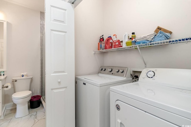 clothes washing area featuring washing machine and clothes dryer