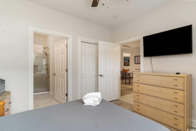 bedroom featuring ceiling fan, connected bathroom, and a closet