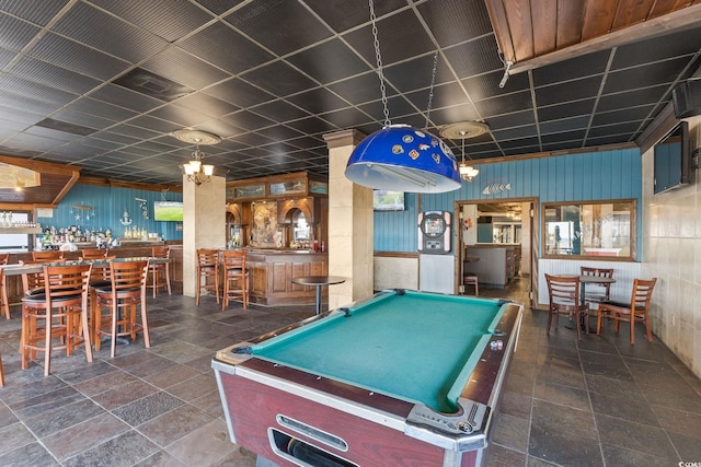 game room with a paneled ceiling and pool table