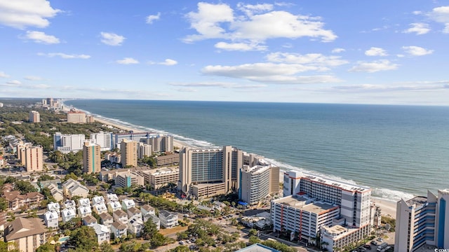 birds eye view of property featuring a water view and a view of the beach