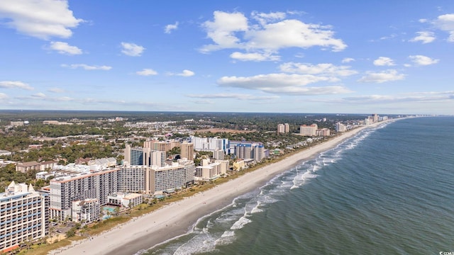 birds eye view of property with a beach view and a water view