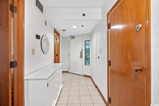 4800 S Ocean Blvd Unit 1219, North Myrtle Beach, SC 29582 - hallway featuring baseboards, visible vents, and light tile patterned floors