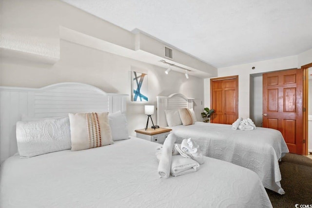 4800 S Ocean Blvd Unit 1219, North Myrtle Beach, SC 29582 - bedroom featuring track lighting and visible vents