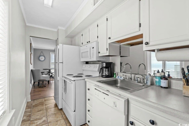 9400 Shore Dr Unit 312, Myrtle Beach, SC 29572 - kitchen featuring white cabinets, light countertops, ornamental molding, a sink, and white appliances