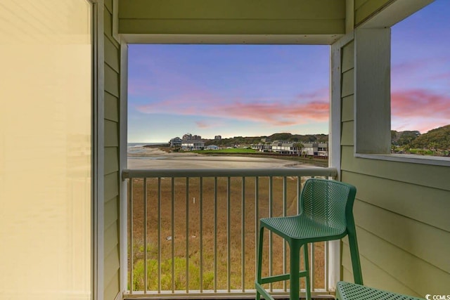 view of balcony at dusk