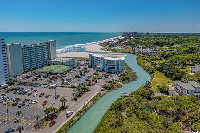 bird's eye view featuring a water view and a beach view