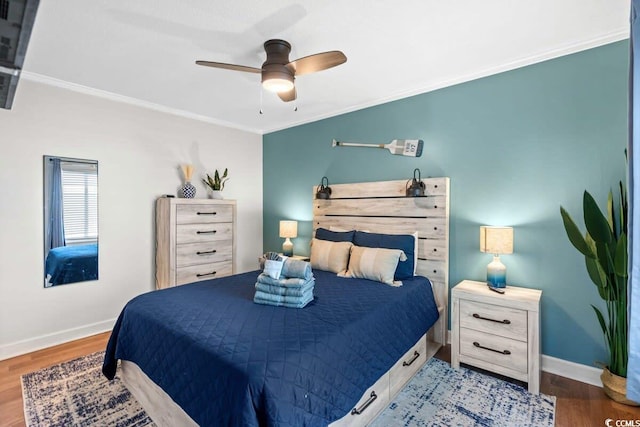 9400 Shore Dr Unit 312, Myrtle Beach, SC 29572 - bedroom featuring wood finished floors, crown molding, baseboards, and ceiling fan