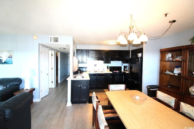 5905 S Kings Hwy Unit 545-B, Myrtle Beach, SC 29575 - dining area with a chandelier and light wood finished floors