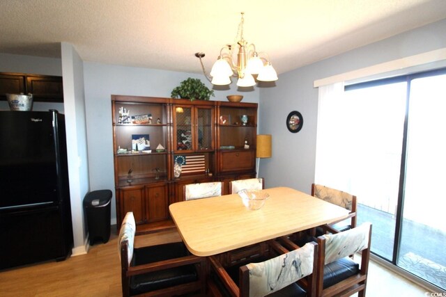 5905 S Kings Hwy Unit 545-B, Myrtle Beach, SC 29575 - dining space with a chandelier and light wood-style flooring