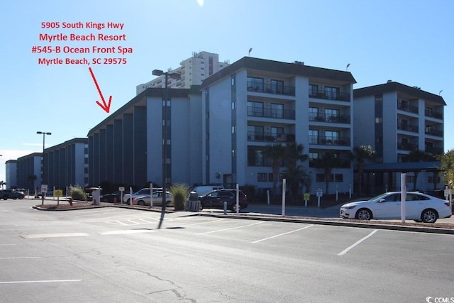 5905 S Kings Hwy Unit 545-B, Myrtle Beach, SC 29575 - view of building exterior with uncovered parking