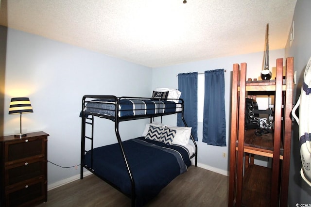 5905 S Kings Hwy Unit 545-B, Myrtle Beach, SC 29575 - bedroom featuring dark wood finished floors and a textured ceiling