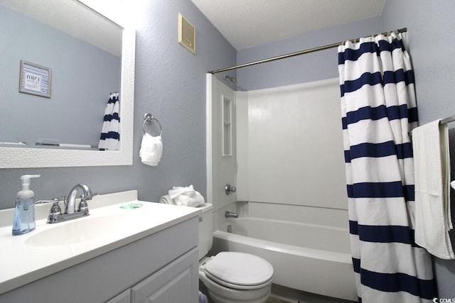 full bathroom with shower / tub combo with curtain, vanity, a textured ceiling, and toilet