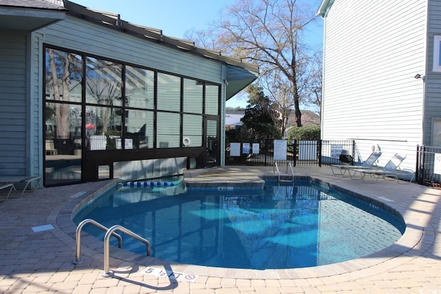 view of swimming pool featuring a patio area