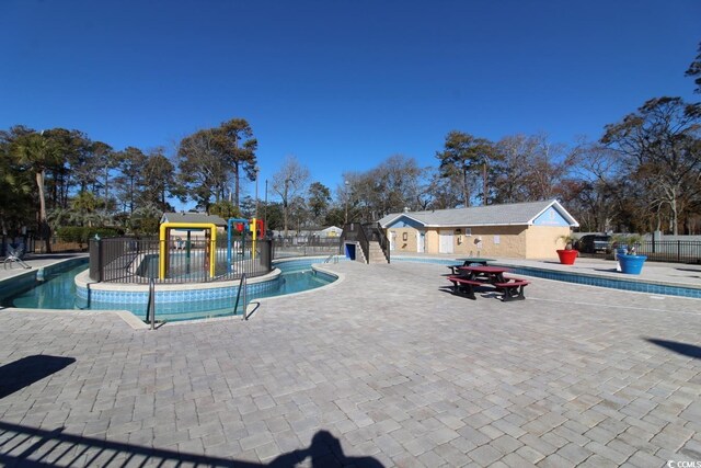 5905 S Kings Hwy Unit 545-B, Myrtle Beach, SC 29575 - community pool with a water play area and a patio