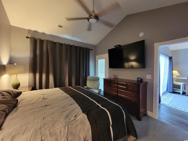 bedroom with carpet flooring, ceiling fan, and lofted ceiling