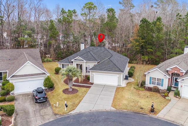 view of front facade featuring a garage and a front lawn