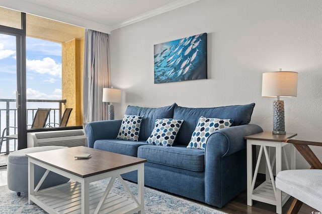 living room featuring a textured ceiling, floor to ceiling windows, and crown molding