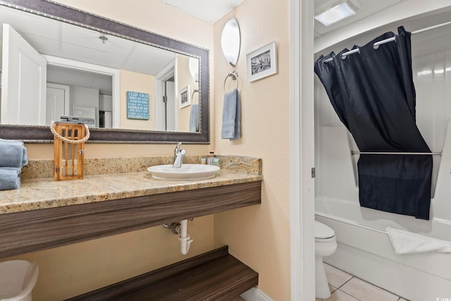 full bathroom with tile patterned floors, sink, shower / bathtub combination with curtain, and toilet