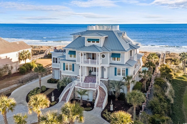 aerial view featuring a water view and a view of the beach