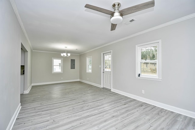 interior space featuring ceiling fan with notable chandelier, light wood-type flooring, crown molding, and a healthy amount of sunlight