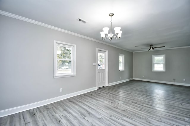 spare room with ceiling fan with notable chandelier, light wood-type flooring, and ornamental molding