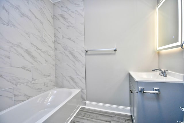 bathroom with vanity, wood-type flooring, and tub / shower combination