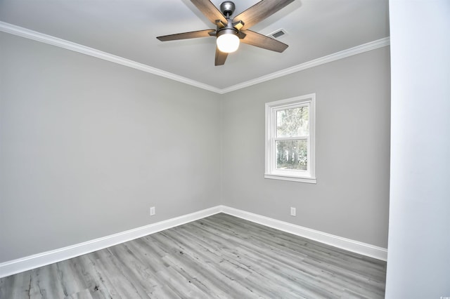 empty room with ceiling fan, ornamental molding, and light hardwood / wood-style flooring