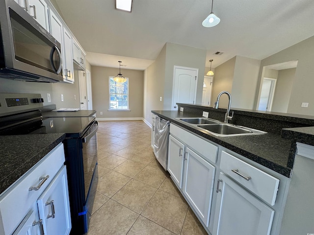 kitchen with white cabinets, hanging light fixtures, appliances with stainless steel finishes, and sink