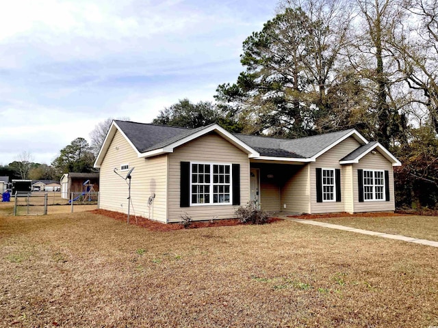 ranch-style house with a front lawn