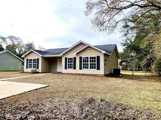 ranch-style home featuring central AC unit