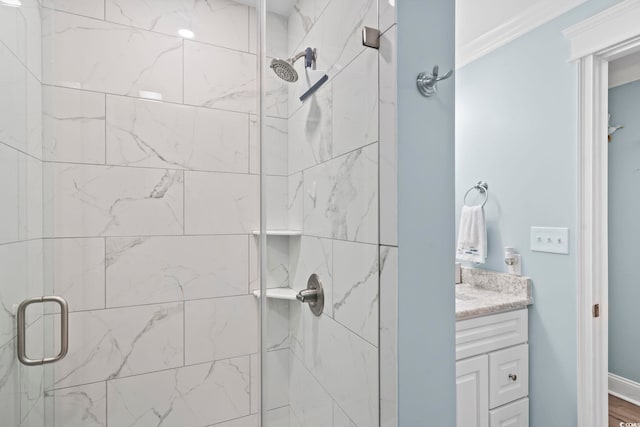 bathroom featuring vanity and an enclosed shower