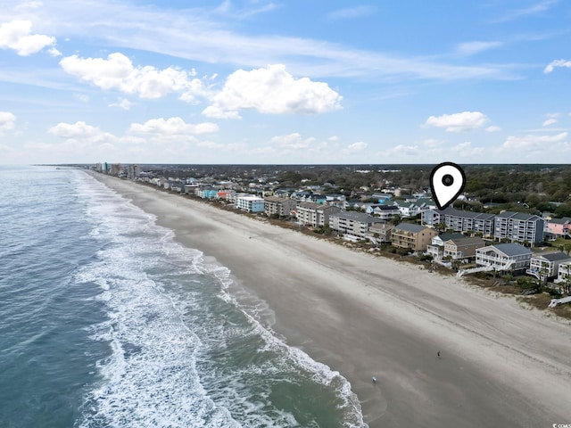 bird's eye view featuring a beach view and a water view