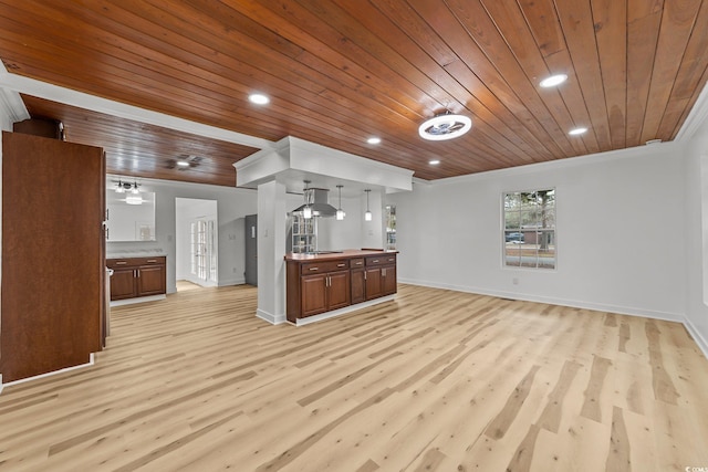 kitchen with hanging light fixtures, open floor plan, crown molding, and recessed lighting