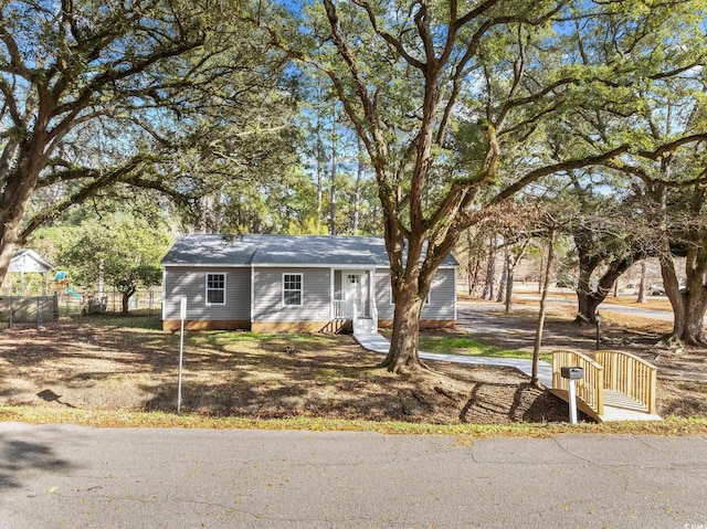 view of front of home with fence